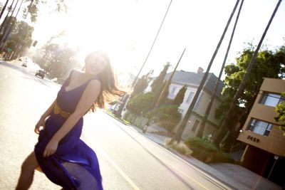 Woman walking on road