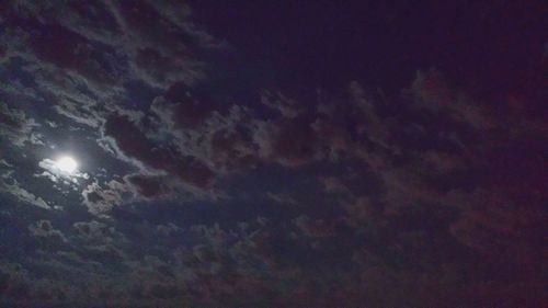 Low angle view of dramatic sky at night