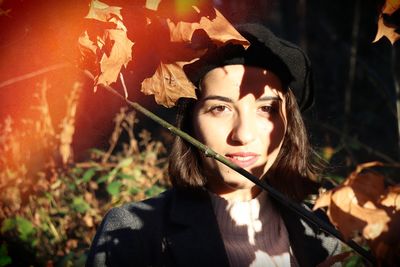 Portrait of young woman in autumn