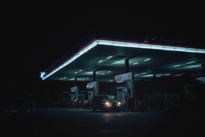 View of illuminated street lights at night