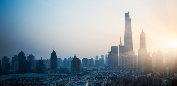 Modern buildings in city against sky