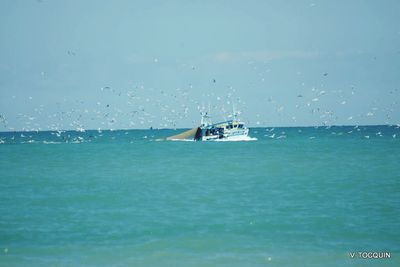 Boat sailing in sea