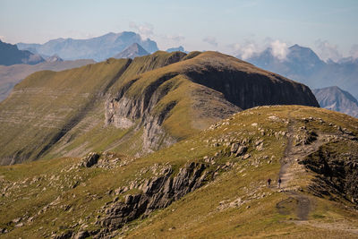 View of dramatic landscape against mountain range