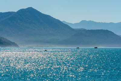 Scenic view of sea against clear blue sky