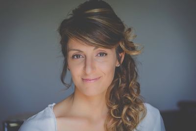 Close-up portrait of smiling young woman