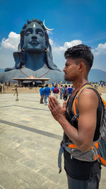 Man standing statue against sky