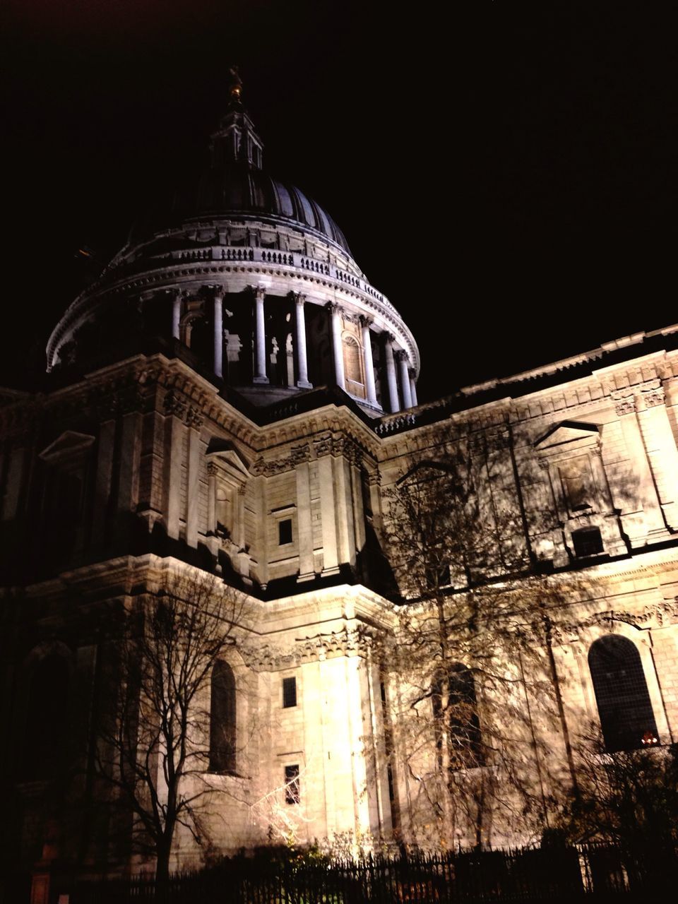 architecture, building exterior, built structure, low angle view, church, religion, place of worship, night, spirituality, cathedral, clear sky, history, window, old, sky, travel destinations, arch, facade