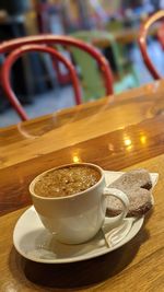 Close-up of coffee cup on table