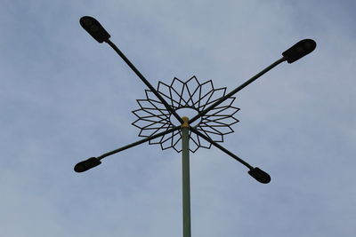 Low angle view of street light against sky