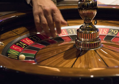 Close-up of person playing guitar on table