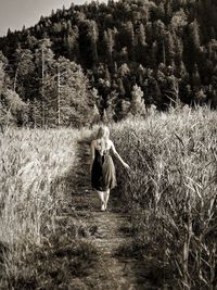 Full length of woman standing on field