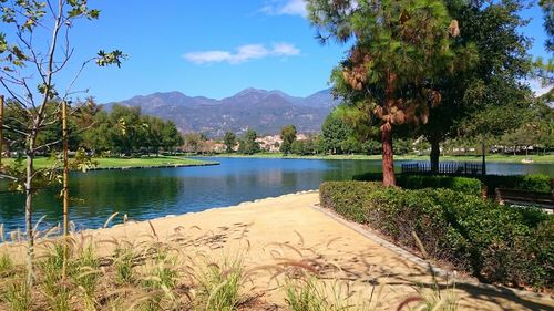 Scenic view of lake and mountains against sky