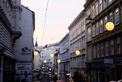 Low angle view of illuminated buildings against sky