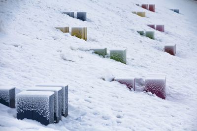 Snow covered buildings on field