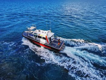 High angle view of ship sailing in sea