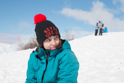 Woman wearing winter clothing in snowy mountain