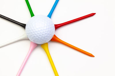 Close-up of multi colored ball on white background