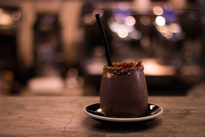 Close-up of drink served on table at cafe