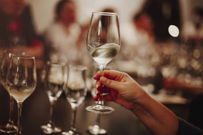 Close-up of hand holding wine glass