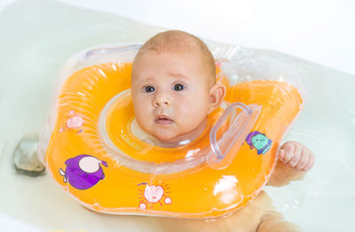 High angle view of cute baby girl in bathtub