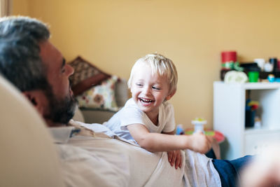 Happy friends sitting at home