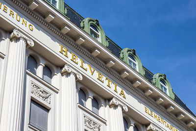 Low angle view of building against blue sky