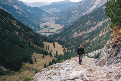 Rear view of man on mountain range