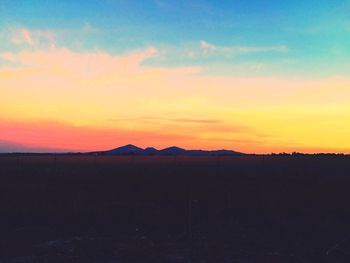 Scenic view of landscape against sky during sunset