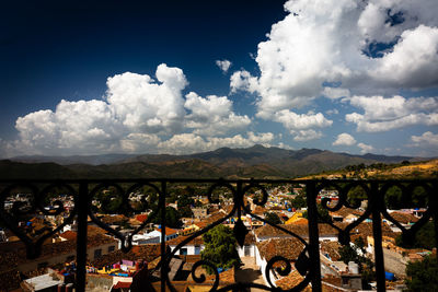 Panoramic shot of bridge in city against sky