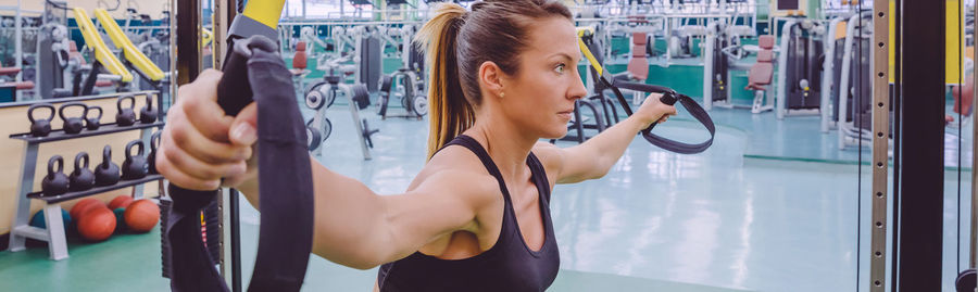 Midsection of woman standing at home