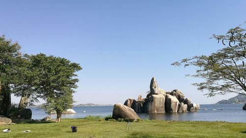 Rock formations in lake victoria against sky