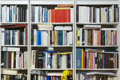 Full frame shot of books arranged in shelf