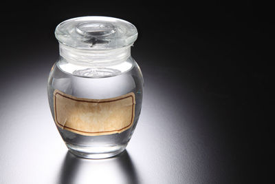 Close-up of glass jar on table