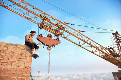 Low angle view of construction site against sky