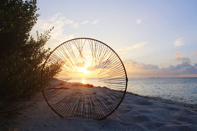 Scenic view of beach against sky during sunset