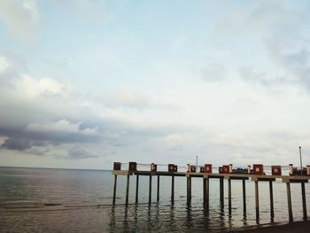 Pier over sea against sky