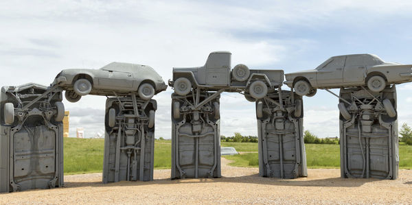 Built structure on field against sky