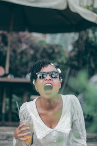 Portrait of woman wearing sunglasses