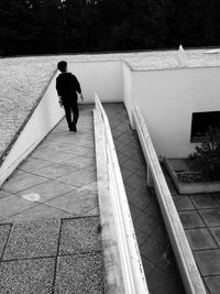 High angle view of man walking on staircase