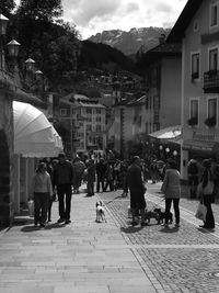 People on street in front of buildings