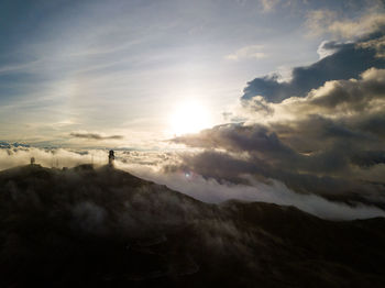 Scenic view of silhouette mountains against sky during sunset