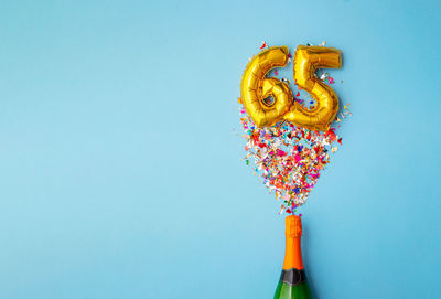 Directly above shot of christmas decorations against blue background