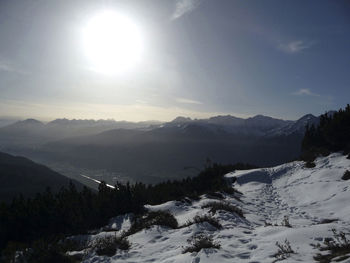 Scenic view of snowcapped mountains against sky