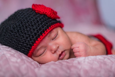 Close-up of cute baby girl sleeping