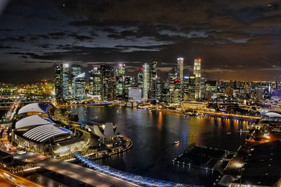 High angle view of illuminated buildings in city at night