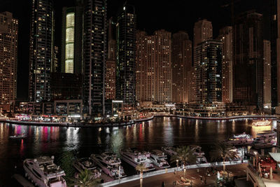 Illuminated buildings in city at night