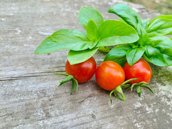 Close-up of fresh fruits and leaves on table