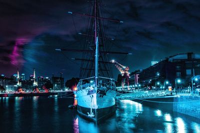 Boats moored at harbor