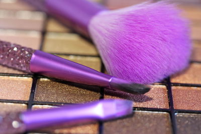 Close-up of make-up brushes with palette