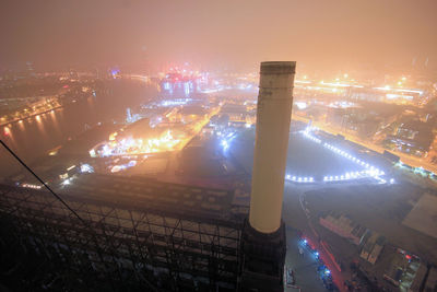 High angle view of illuminated buildings in city at night